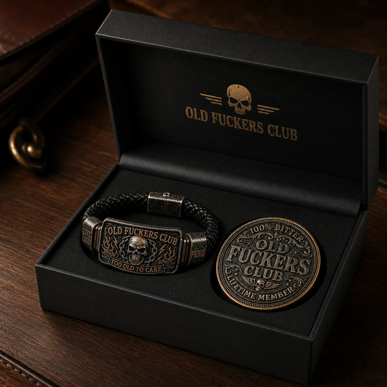 Old Fuckers Club bracelet and coin gift box on a dark wooden table